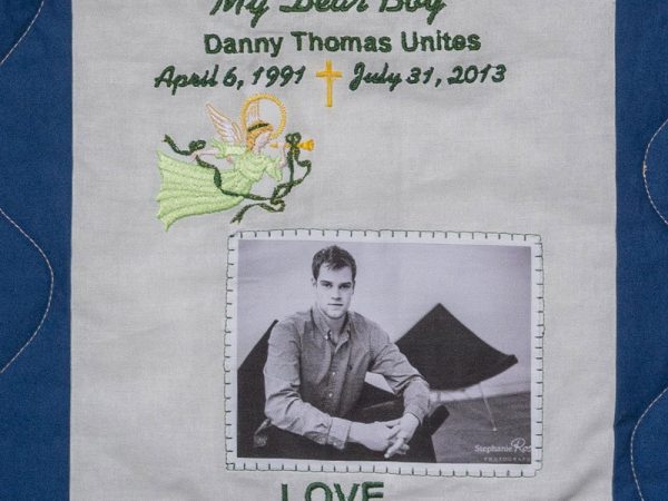 Quilt square for Daniel Unites with outdoor portrait of Daniel and text reading: My Dear Boy.