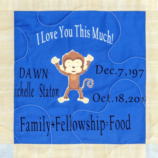 Quilt square for Dawn Staton with patch of a monkey and text reading: I love you this much! Family plus Fellowship equals Food