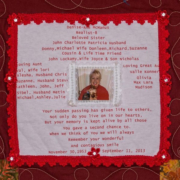 Quilt square for Denise McManus with photo of Denise holding a small dog and text reading: Your sudden passing has given life to others. Not only do you live on in our hearts, but your memory is kept alive by all those. You gave a second chance to. When we think of you, we will always remember your wonderful and contagious smile.