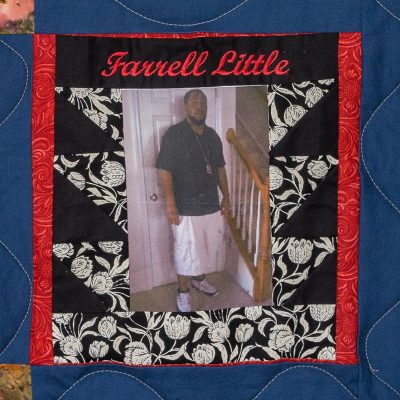 Quilt square for Farrell Little with photo of Farrell standing inside home.