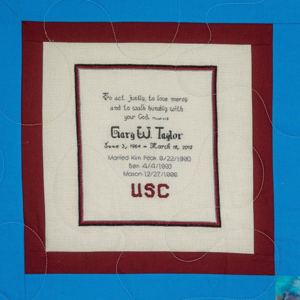 Quilt square for Gary Taylor with text reading: To act justly, to love mercy, and to walk humbly with your God. USC.