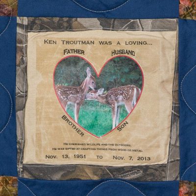 Quilt square for Ken Troutman with a photo of two fawns masked in the shape of a heart.