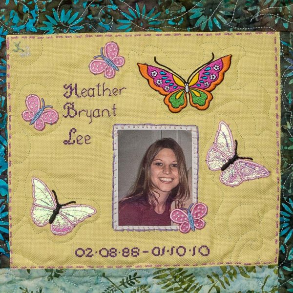 Quilt square for Heather Lee with butterflies and a portrait photo of Heather