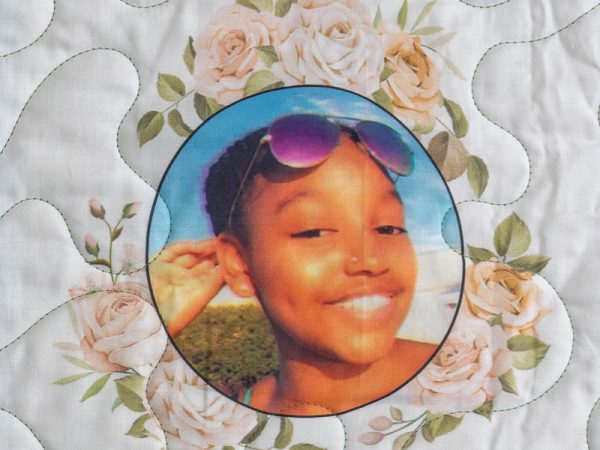 Quilt square for Imani McDonald with photo of Imani and flowers