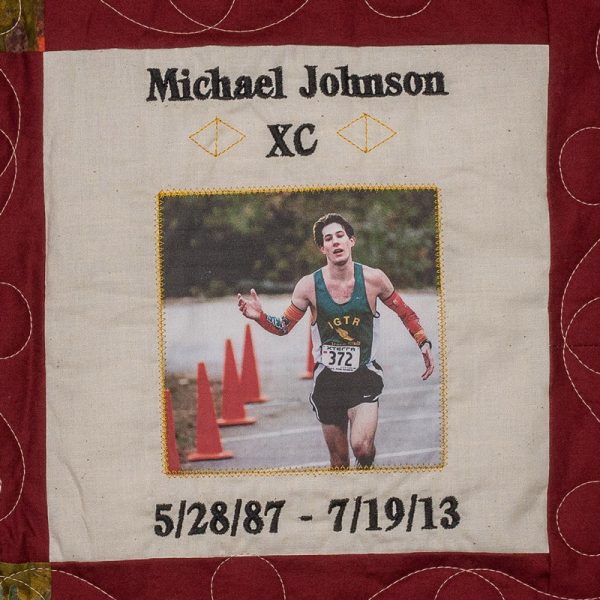 Quilt square for Michael Johnson with a photo of Michael running in a track suite.
