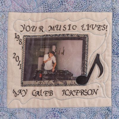 Quilt square for Jay Dickerson with a photo of Jay at a DJ table and text reading: Your music lives!