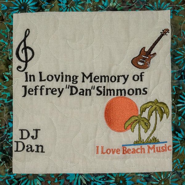 Quilt square for Jeffrey Simmons with musical notes, a guitar, palm trees and sun, and text reading: I love beach music.