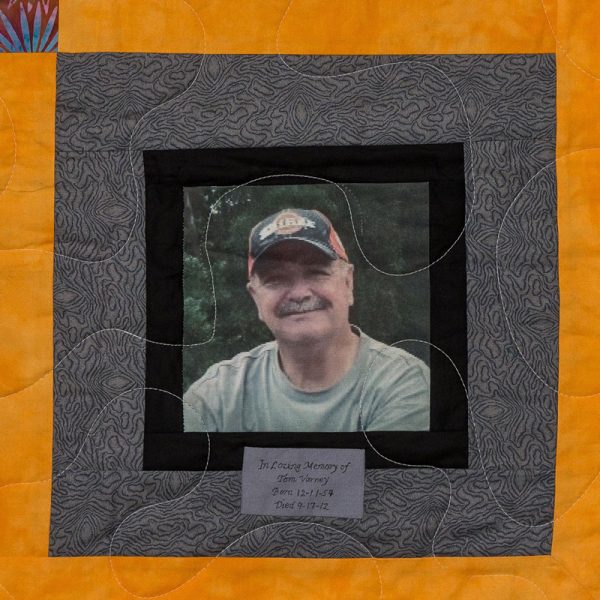Quilt square for Leonard Varney with a photo of Leonard.