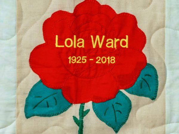 Quilt square for Lola Ward with large red rose