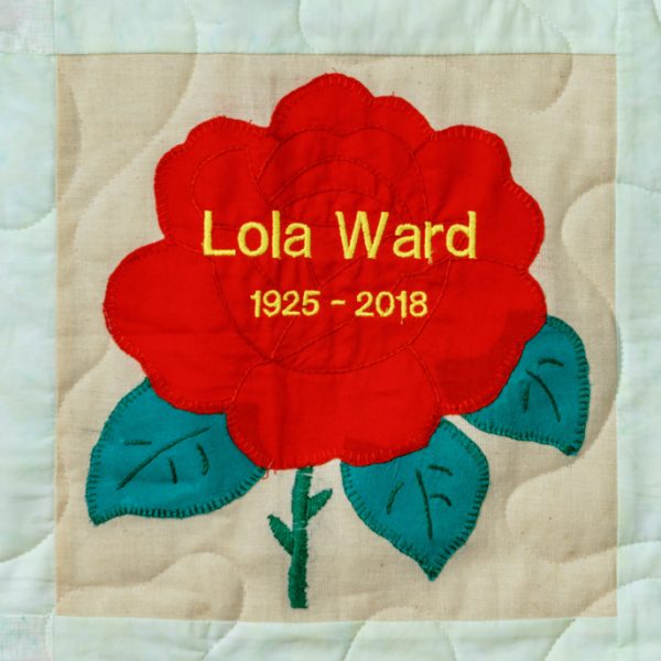 Quilt square for Lola Ward with large red rose