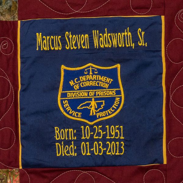 Quilt square for Marcus Wadsworth with patch of N.C. Department of Correction. Division of Prisons, Service, Protection.