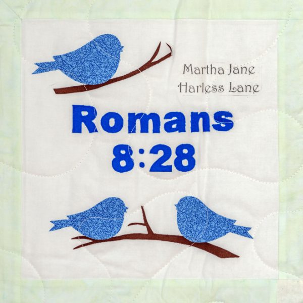 Quilt square for Martha Lane with three birds on branches and text reading: Romans 8:28