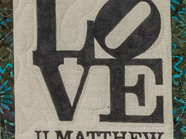 Quilt square for Matthew Byrd with text reading: we all love you. XO XO XO.
