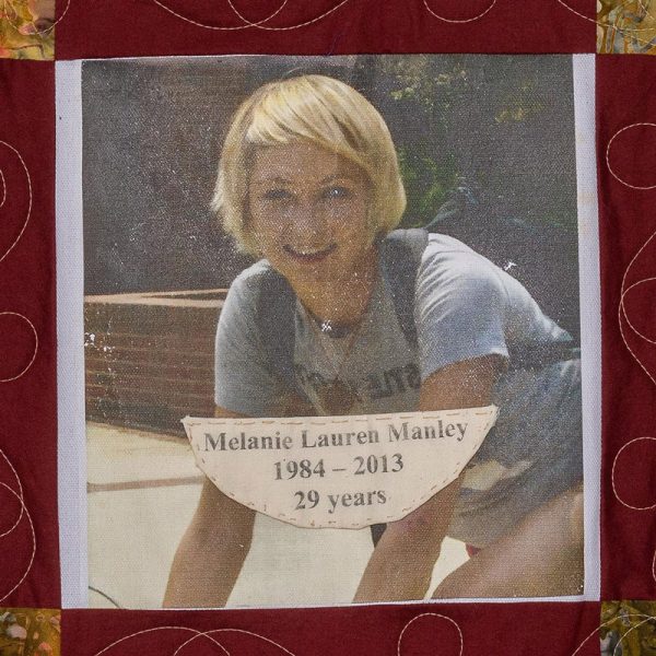 Quilt square for Melanie Manley with a photo of Melanie wearing a school backpack outside
