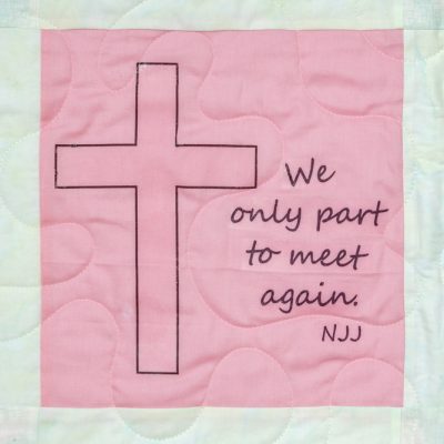 Quilt square for Norma James with cross and text reading: We only part to meet again. NJJ