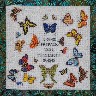 Quilt square for Patrick Friedhoff with many different types and colors of butterflies