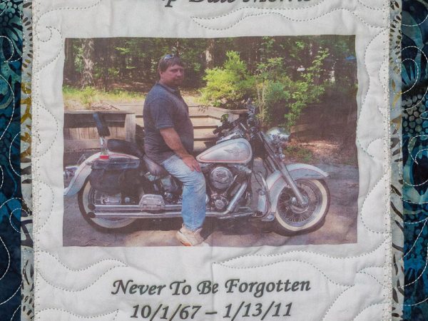 Quilt square for Phillip Dale Morris with a photo of Phillip on a motorcycle.