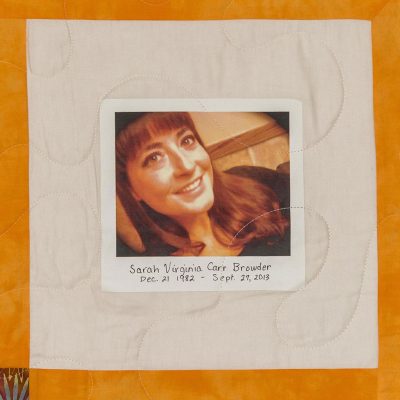 Quilt square for Sarah Harris with portrait of Sarah at the center