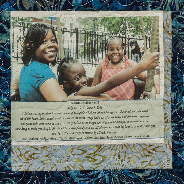 Quilt square for Schelita Smith with a photo of Schelita with kids. A biography of text underneath.