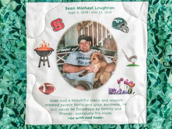 Quilt Square for Sean Loughran with picture of dog and text reading sean had a beautiful smile and always treated people fairly and with kindness. He will never be forgotten by family and friends – especially his mom. Go with God Sean.
