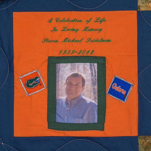 Quilt square for Steven Seidelman with a outdoor portrait of Steven and text reading: A celebration of life.