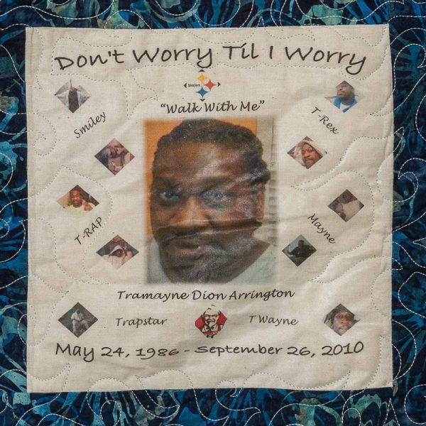 Quilt square for Tramayne Arrington with portrait of Tramayne and text reading: Smiley, T-Rap, Trapstar, T Wayne, Mayne, and T-Rex. Walk with me.