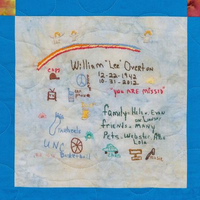 Quilt square for William Overton with angles, tv, cellphone, tarheels, unc basketball, cars, music and text reading: you are missed. Family equals Helen, Evan, and Lindsay. Friends qual many. Pets equal Webster, Allie, Lola.