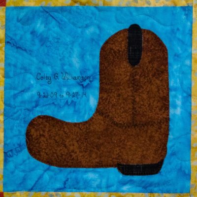 Quilt square for Colby Williamson with a cowboy boot.