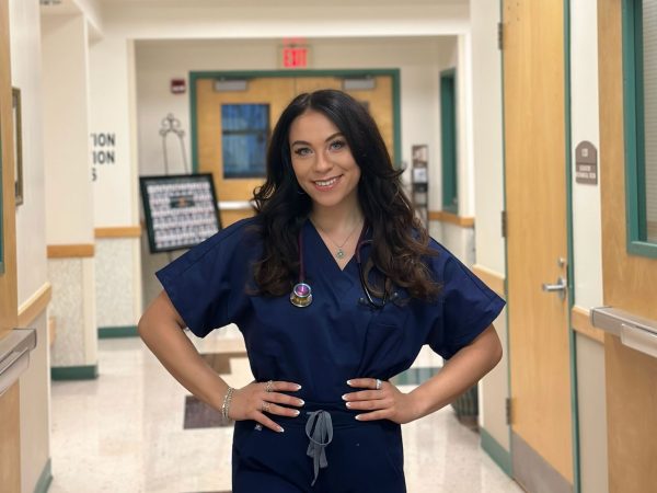 Nurse Sarah Friedman posing in scrubs