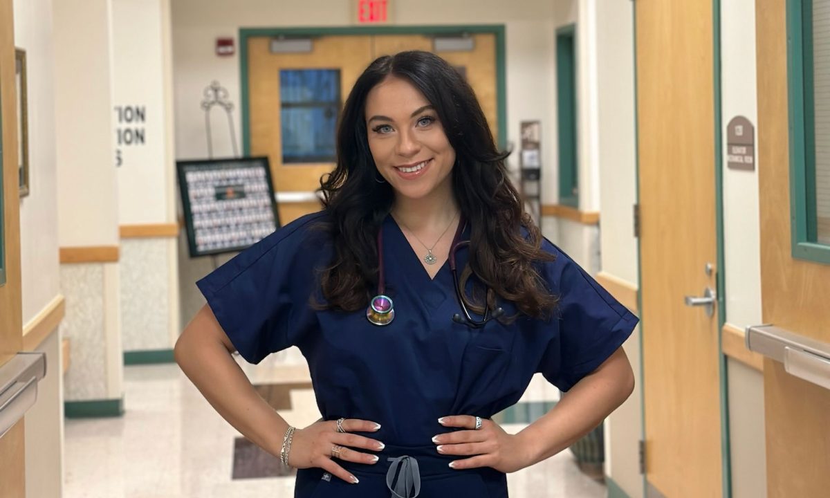 Nurse Sarah Friedman posing in scrubs