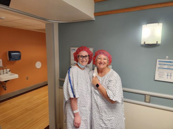 Aly and Pat in hospital gowns