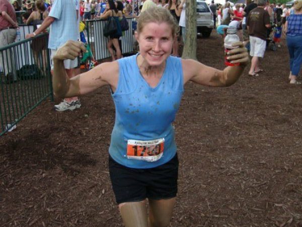 woman after running tough mudder race