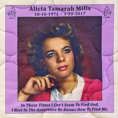 Quilt square for Alicia Tamarah Mills with a portrait of Tamarah and text reading: In those times I can’t seem to find God, I rest iin the assurance he knows how to find me.