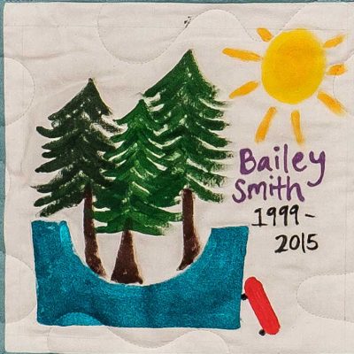 Quilt square for Bailey Smith with the sun, the wood, a skatepark and a skateboard.