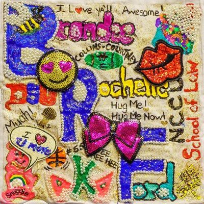 Quilt square for Brandee Ford her name colorfully styled with different shapes and textures including butterflies, ribbons, and bees, and beads. Text reading: I love ya’ll Awesome! Hug Me! Hug Me Now! I love you more. Hee Hee Hee.