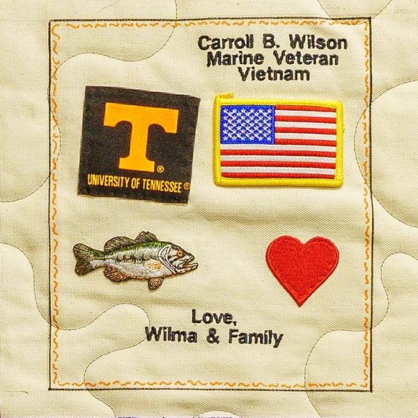 Quilt square for Carroll Wilson with patches of the University of Tennessee, America Flag, Fish, heart, and text reading: love Wilma and family