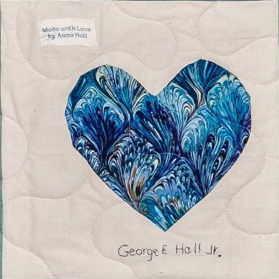 Quilt square for George Hall with a blue heart and text reading made with love