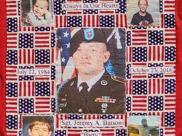 Quilt square for Jeremy Batson with photos of Jeremy at different times in his life and in uniform.