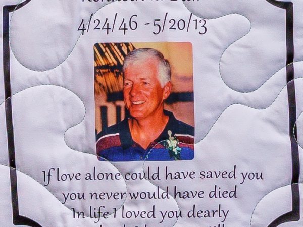 Quilt square for Kenneth E Daw with a photo of Kenneth and text reading: If love alone could have saved you, you never would have died. In life I loved you dearly. In death I love you still.