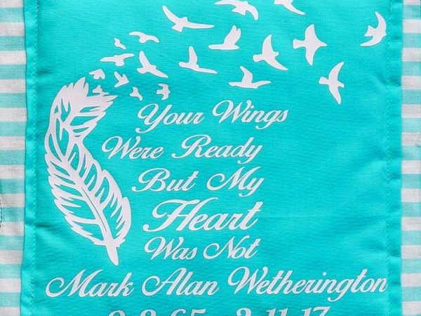 Quilt square for Mark Wetherington with a feather and birds and text reading: Your wings were ready but my heart was not