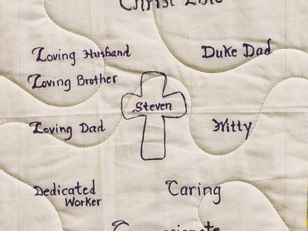 Quilt square for Max Luther with text reading: Christ-Like, Loving husband, brother, dad, dedicated worker, Duke dad, witty, caring, compassionate.
