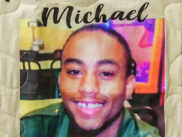 Quilt square for Michael Richardson with a photo of Michael and text reading: rest in peace.