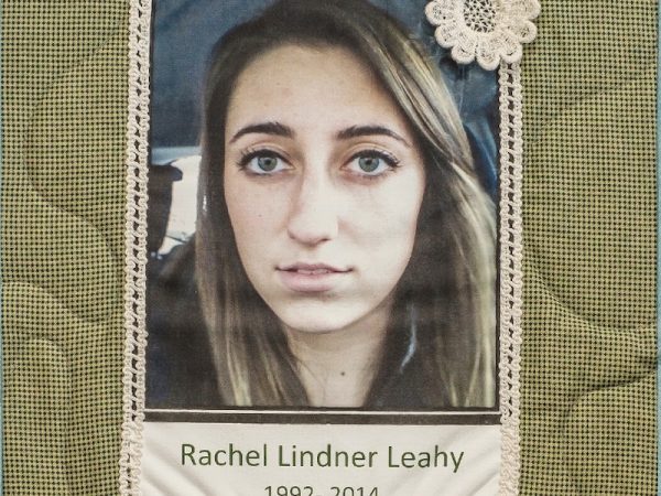 Quilt square for Rachel Lindner Leahy with a photo of Rachel and a patch of a flower in corner