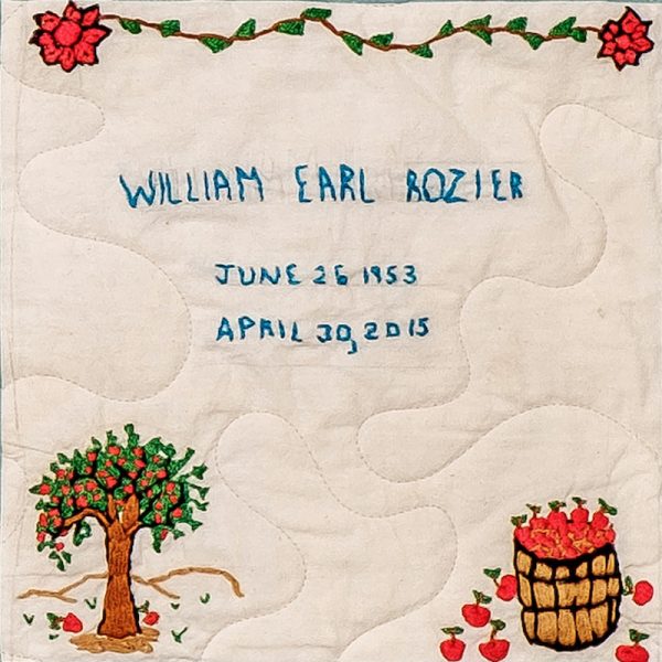 Quilt square for William Earl Rozier with flowers on the top, an apple tree, and a barrel full of apples.