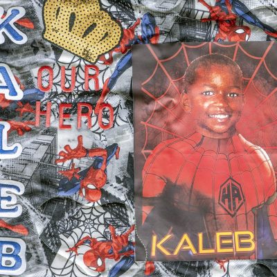 Quilt Square for Kaleb Hawkins with spiderman graphics and photo of Kaleb in spiderman outfit